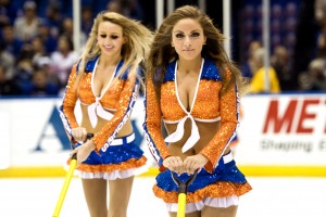 Uniondale, NY. New York Rangers vs New York Islanders. New York Islanders Ice Girls clear the rink of snow and debris during the intermissions and time outs. Tuesday October 29th 2013 (Photo by Anthony Causi)